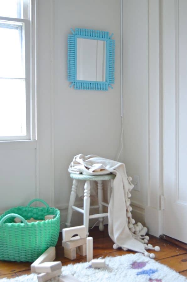 mirror hanging over stool