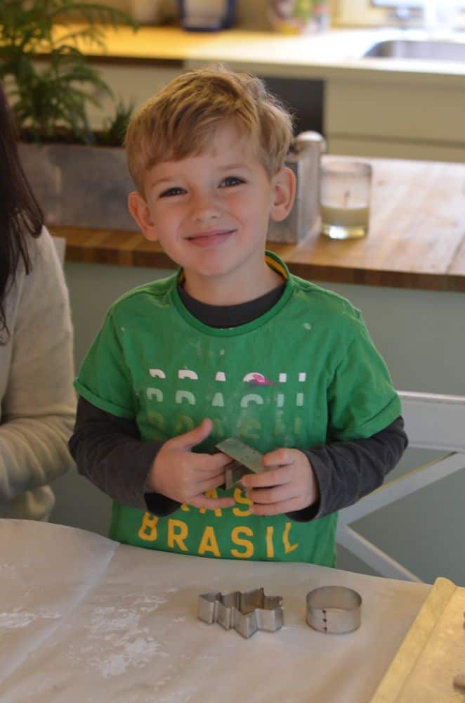 Smiling at cooking table