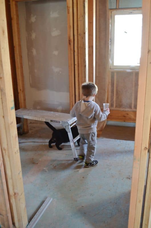 Child with cat in new house