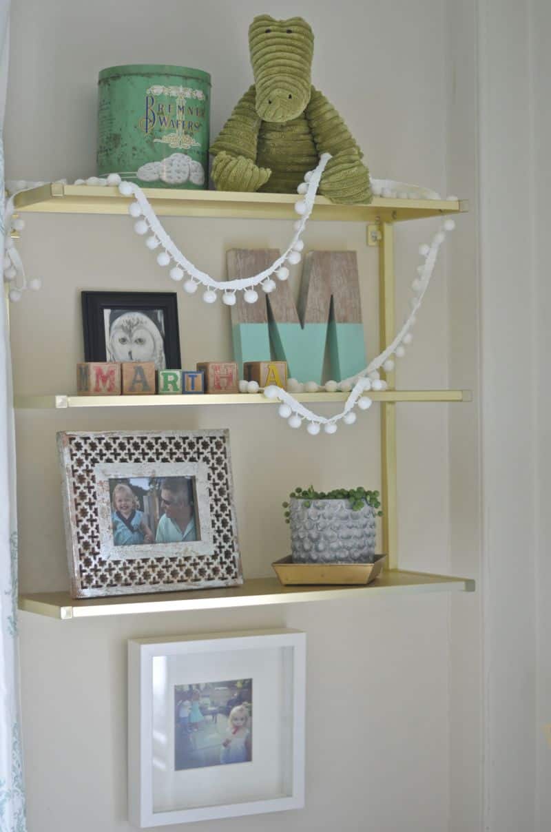 gold shelf above martha's desk