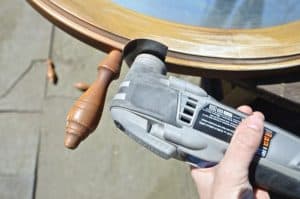 cutting off spindles of nautical mirror