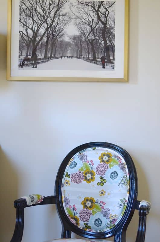 Eclectic foyer pulled together with refurbished furniture and fun fabric and accessories.