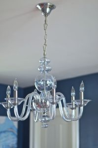 blue glass chandelier in dining room