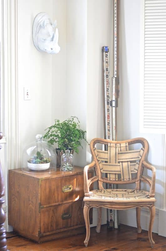 Eclectic foyer pulled together with refurbished furniture and fun fabric and accessories.