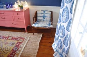 tie dye chair with coral sideboard