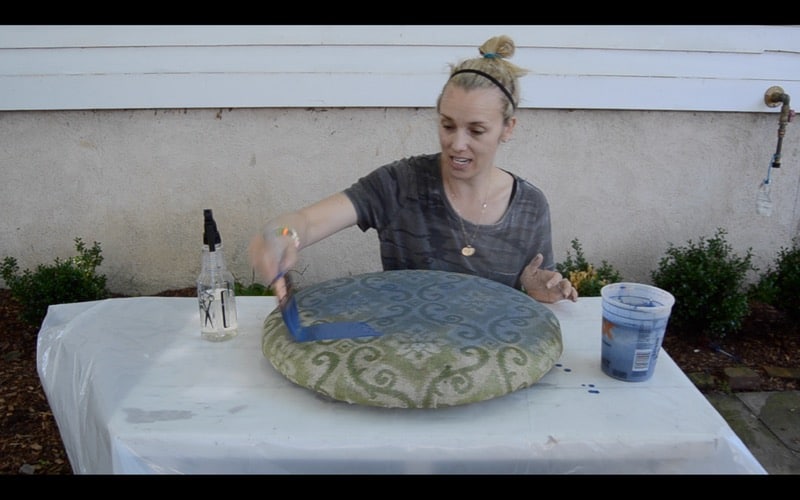 How to makeover patio cushions by painting them with regular ol’ latex paint.