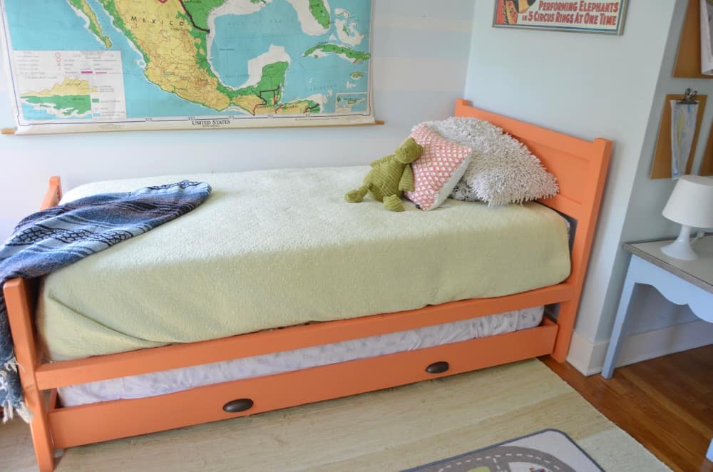 Simple DIY trundle bed to bring in extra sleeping in a kids room.