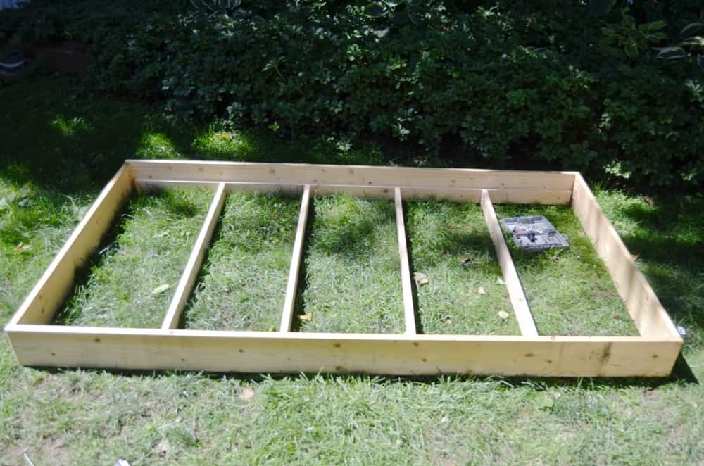 Simple DIY trundle bed to bring in extra sleeping in a kids room.