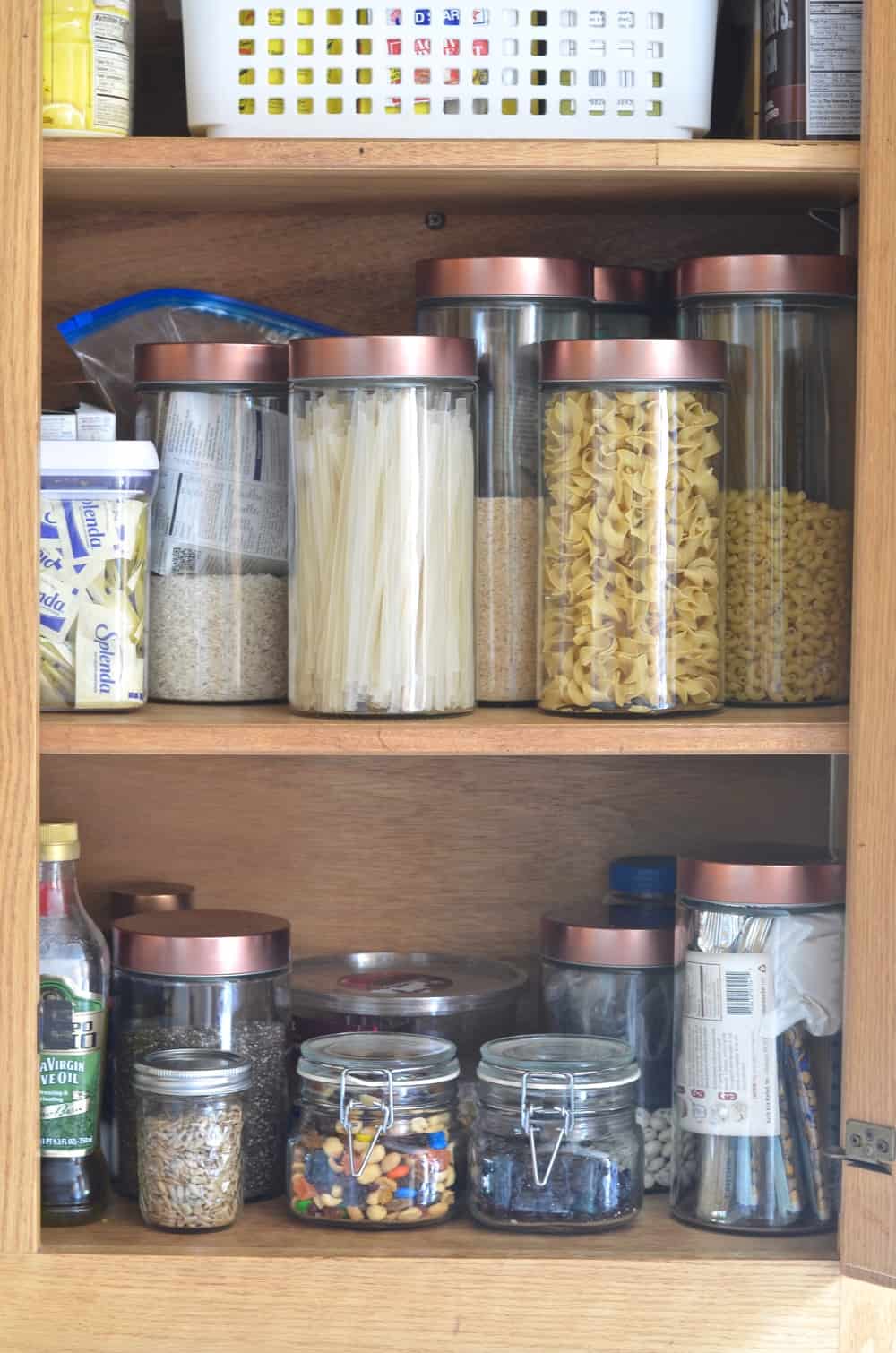 https://atcharlotteshouse.com/wp-content/uploads/2016/08/pantry-with-glass-containers.jpg