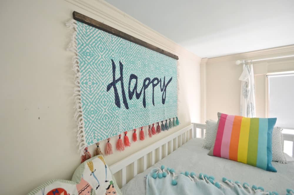 Turn a simple cotton throw rug into a fun custom wall tapestry.