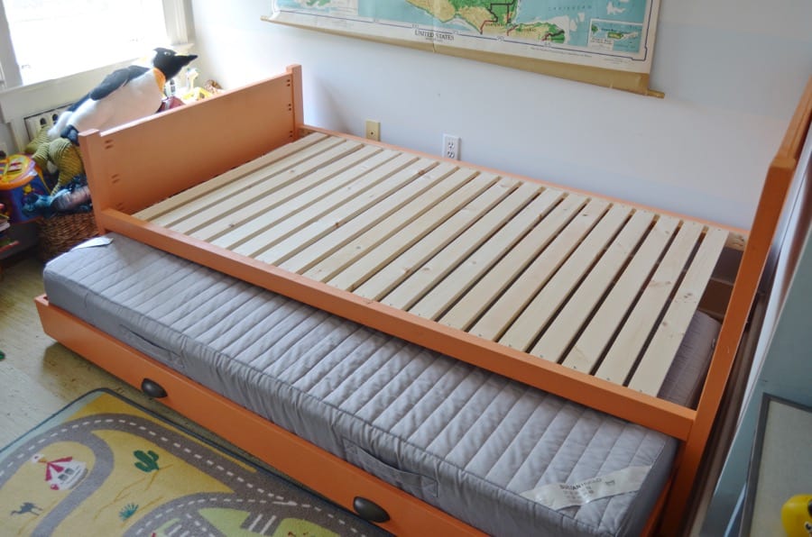 Simple DIY trundle bed to bring in extra sleeping in a kids room.