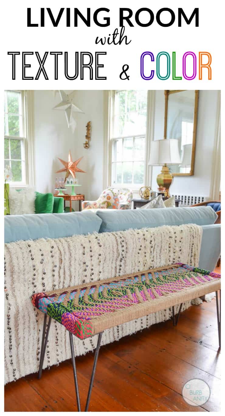 White bright living room with colorful decor and eclectic design.