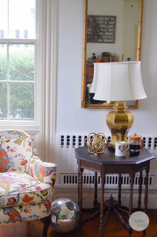 White bright living room with colorful decor and eclectic design.