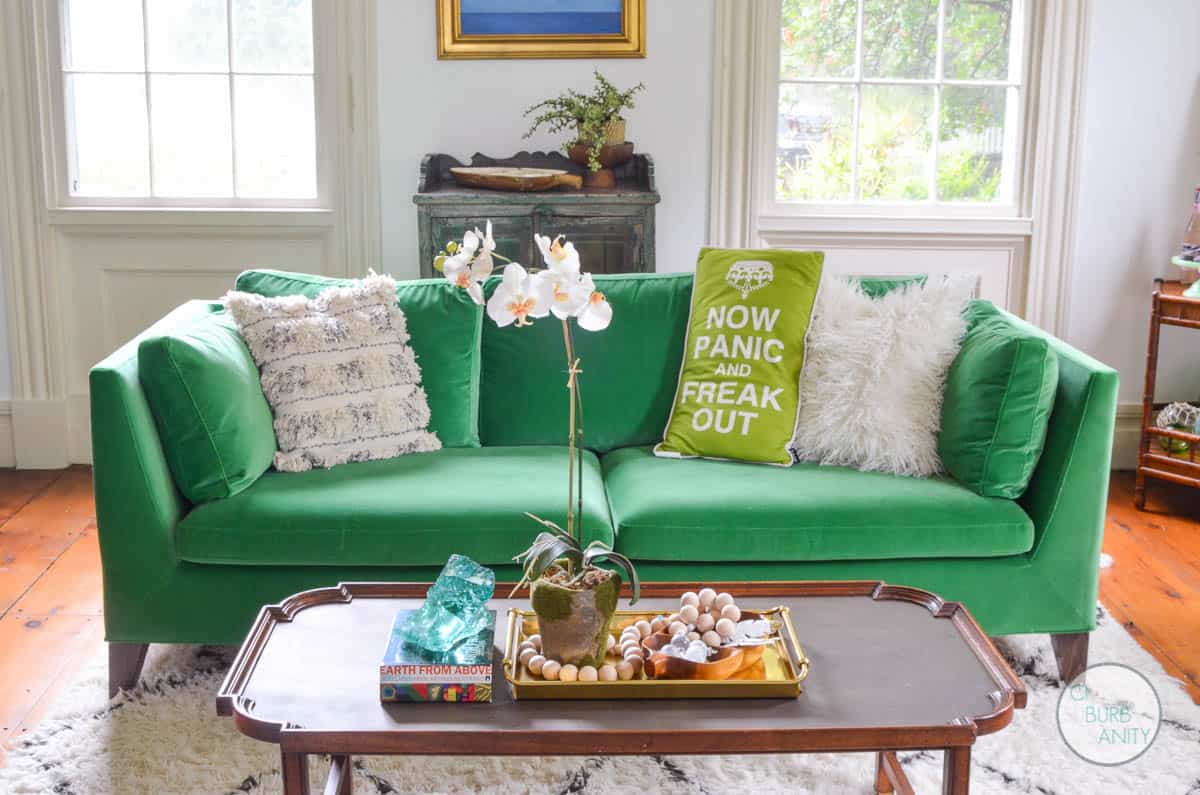 White bright living room with colorful decor and eclectic design.