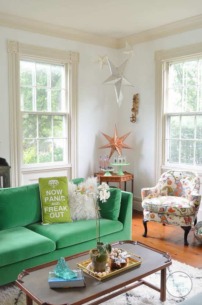 White bright living room with colorful decor and eclectic design.