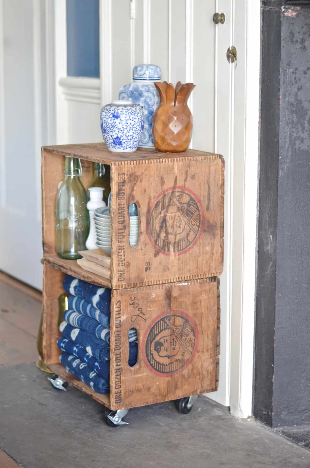 Thrifty storage from flea market crates on casters.