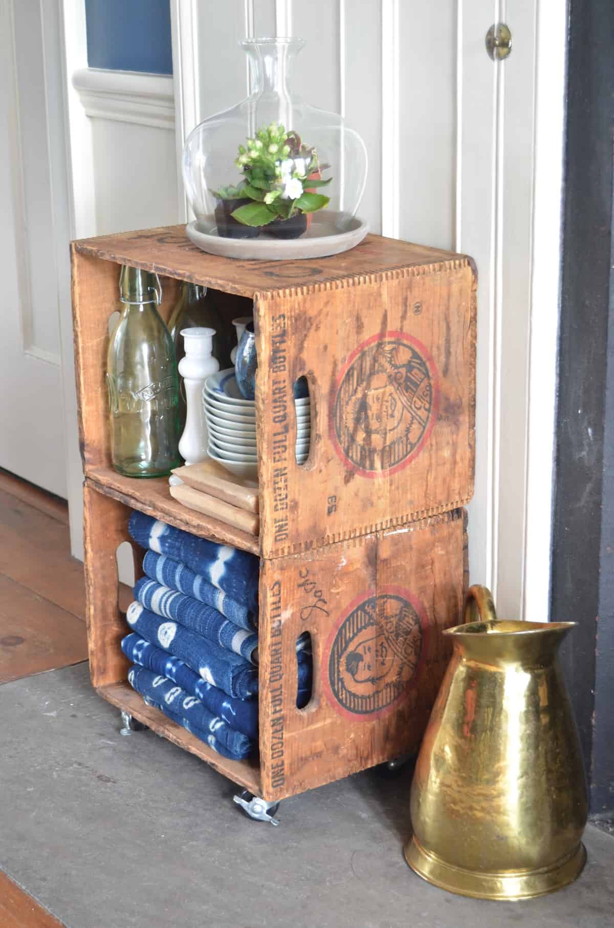 Thrifty storage from flea market crates on casters.