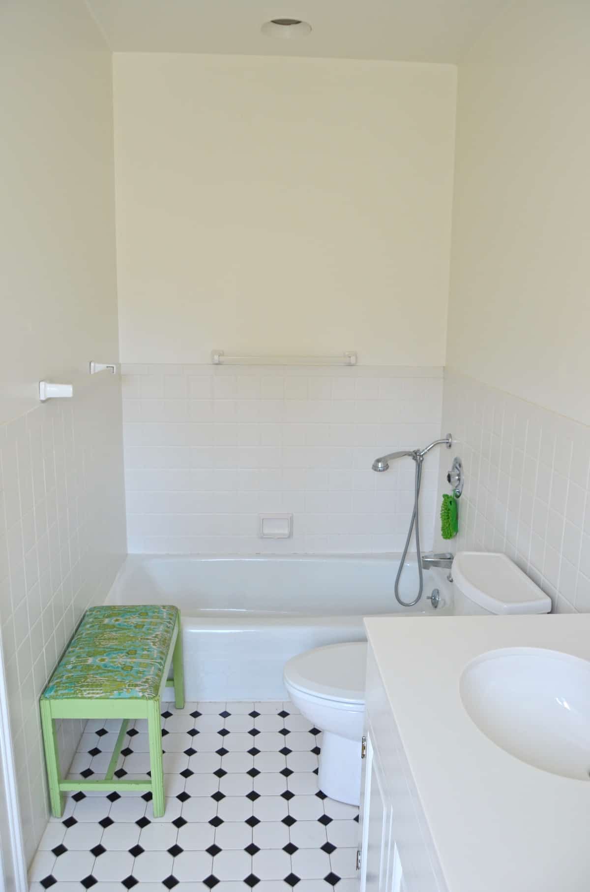 Updated kids bathroom with wallpaper and new pendant lights.