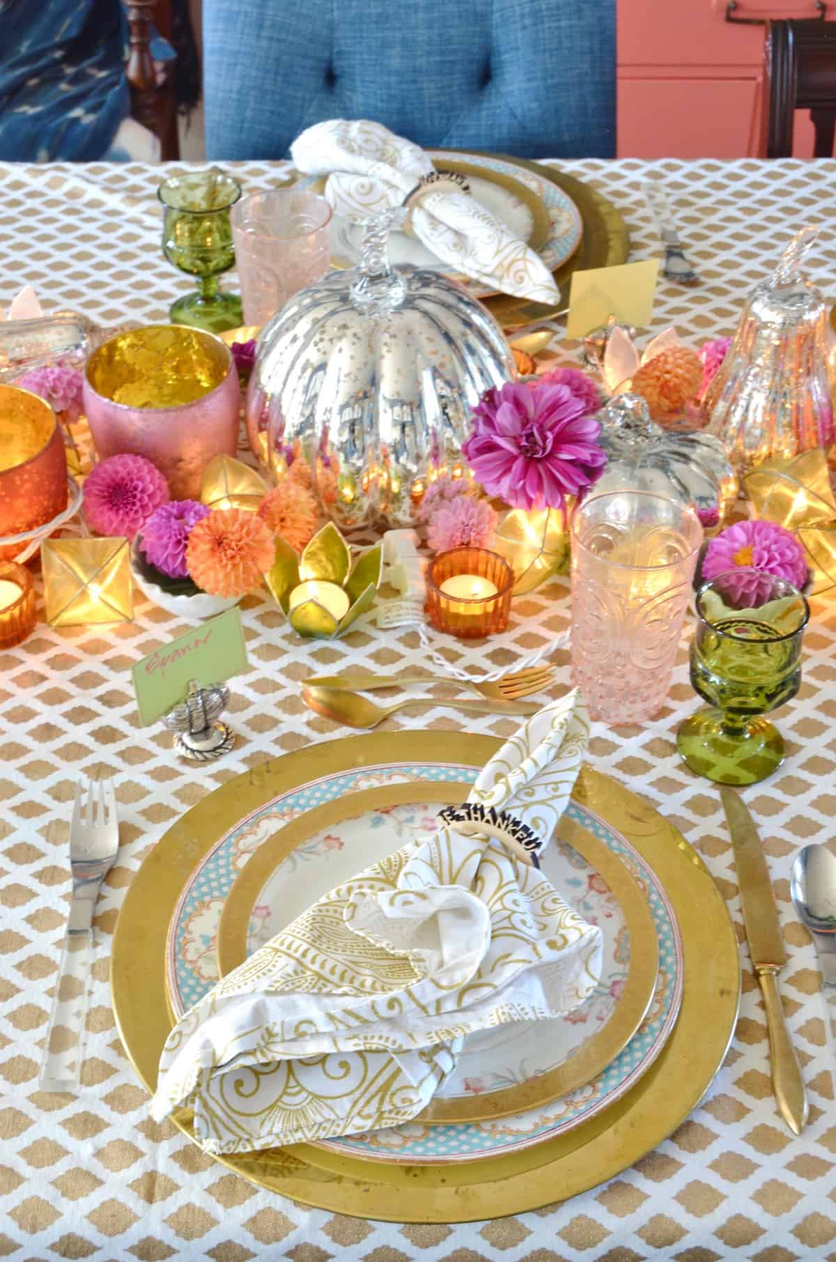 Pink and green and floral eclectic Thanksgiving tablescape.