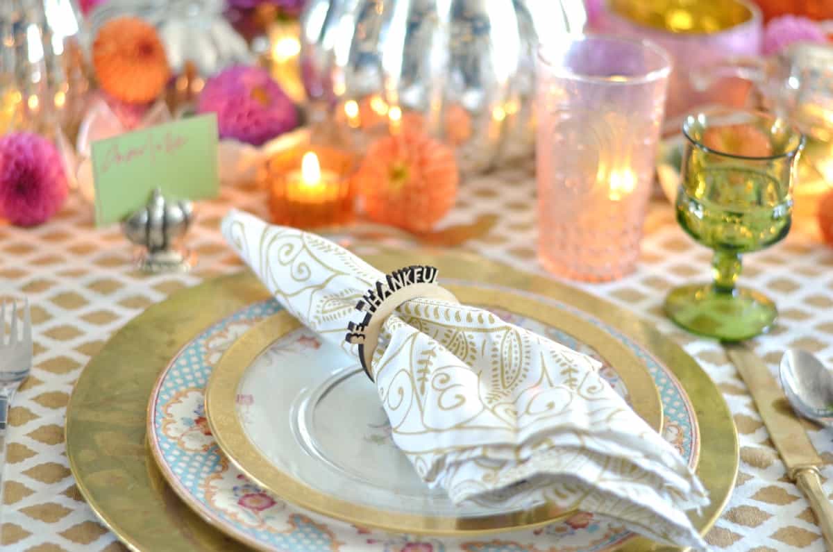 Pink and green and floral eclectic Thanksgiving tablescape.