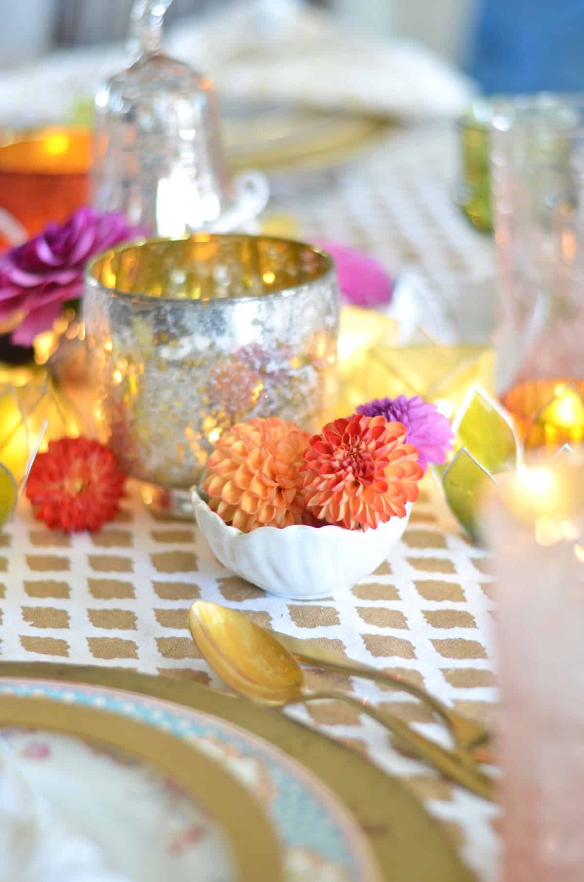 Pink and green and floral eclectic Thanksgiving tablescape.