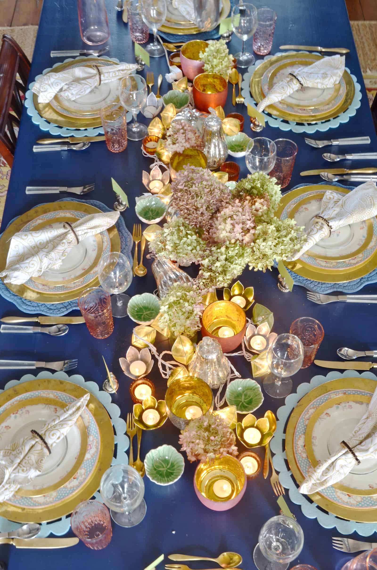 Pink and green and floral eclectic Thanksgiving tablescape.