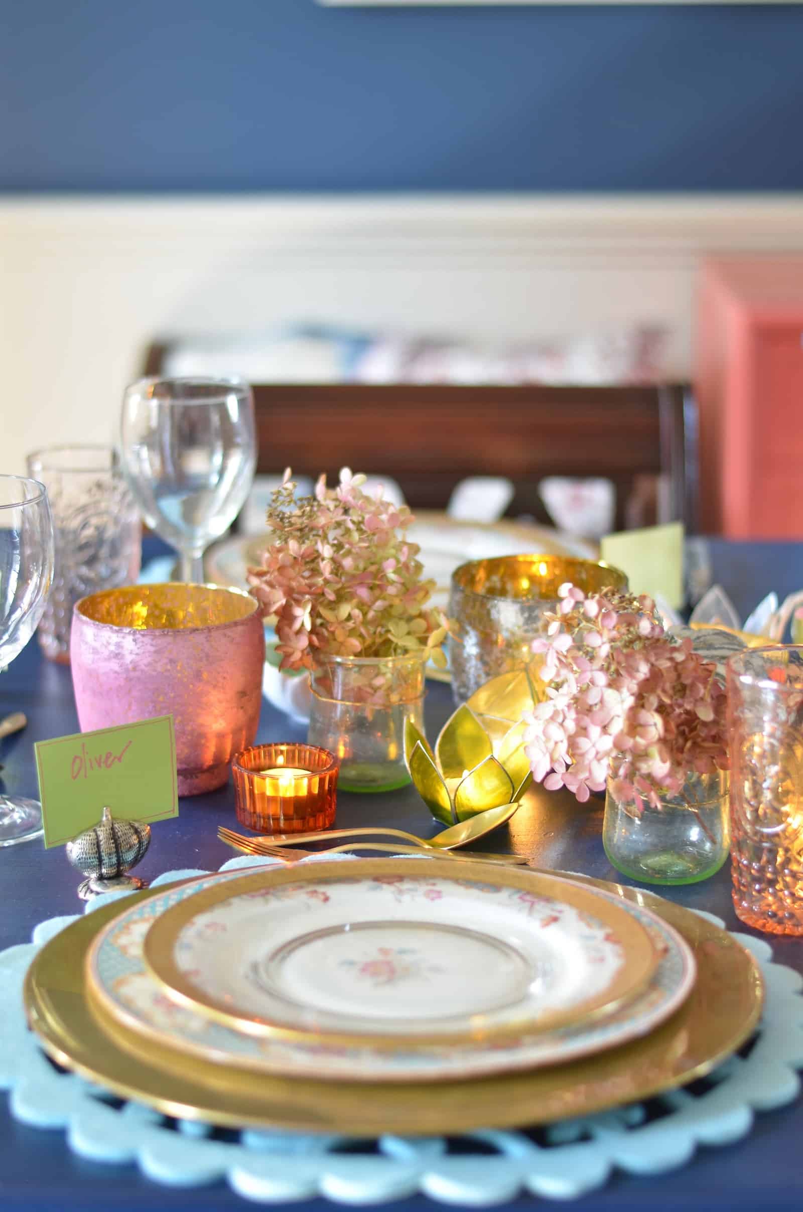 Pink and green and floral eclectic Thanksgiving tablescape.