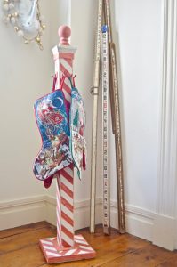 DIY striped lattice holiday stocking post- adorable way to display your stockings this season!