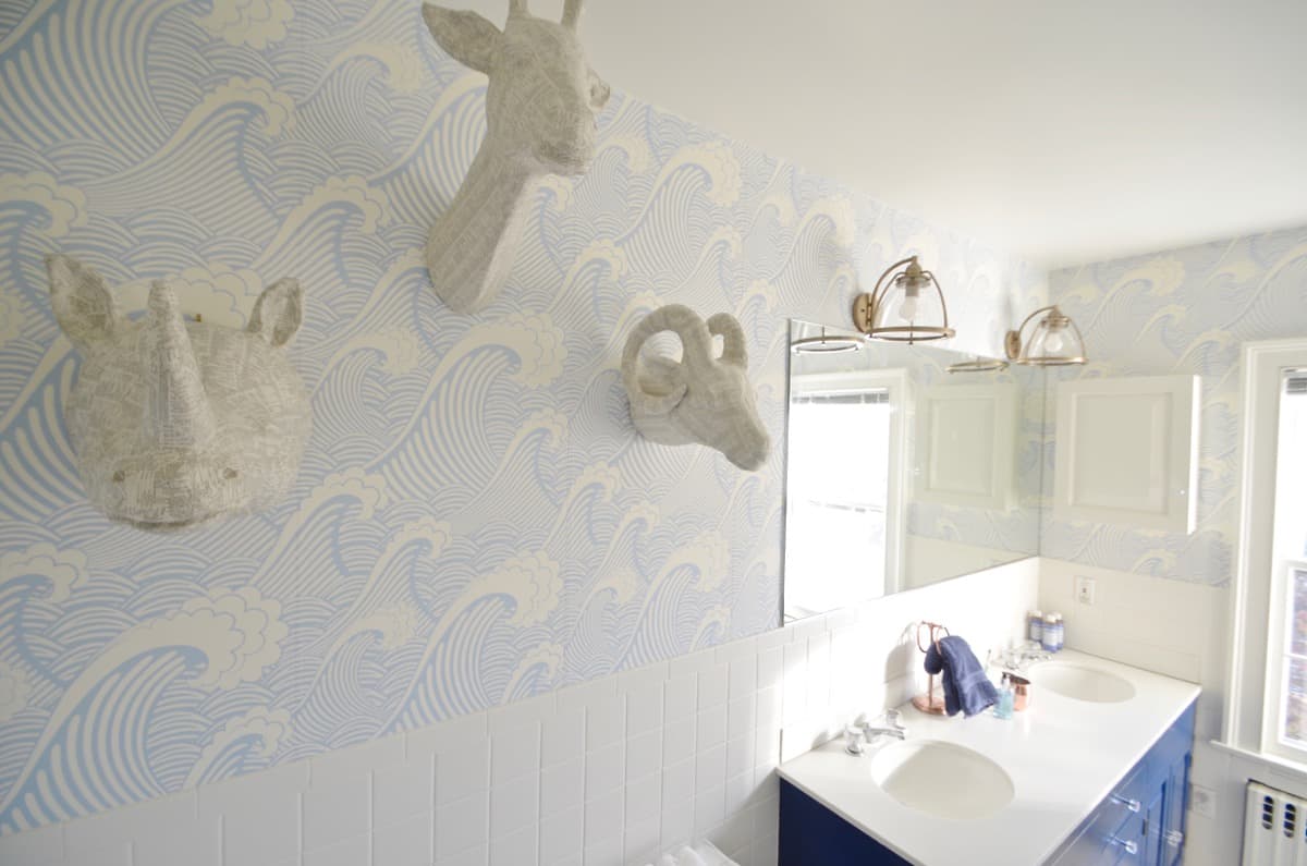 Updated kids bathroom with wallpaper and new pendant lights.