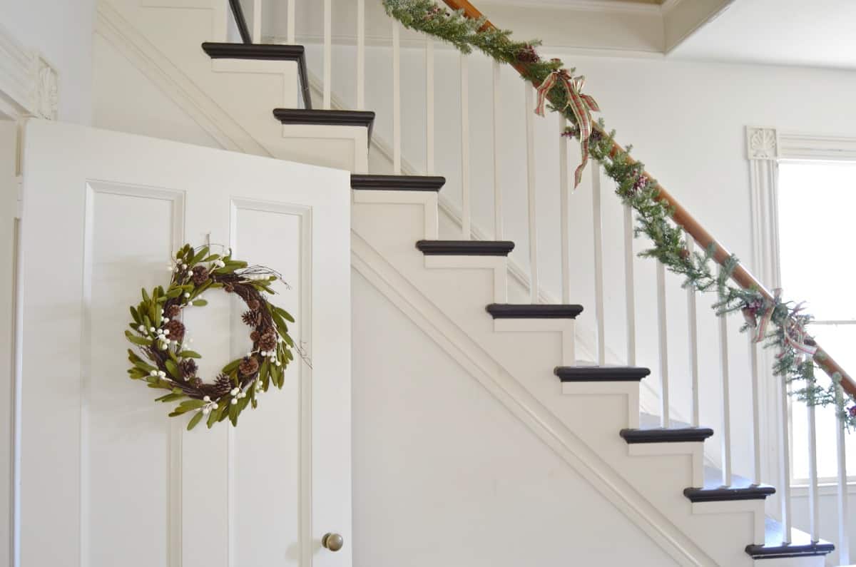 New England holiday house tour with lots of Christmas trees and classic red accents.