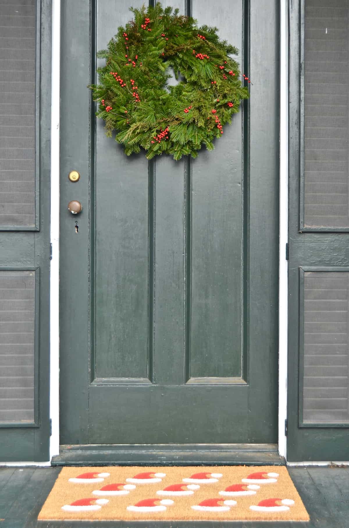 New England holiday house tour with lots of Christmas trees and classic red accents.