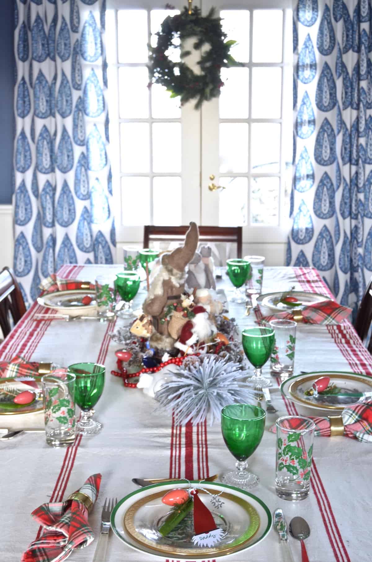 red and green christmas table for our eclectic blue and white dining room