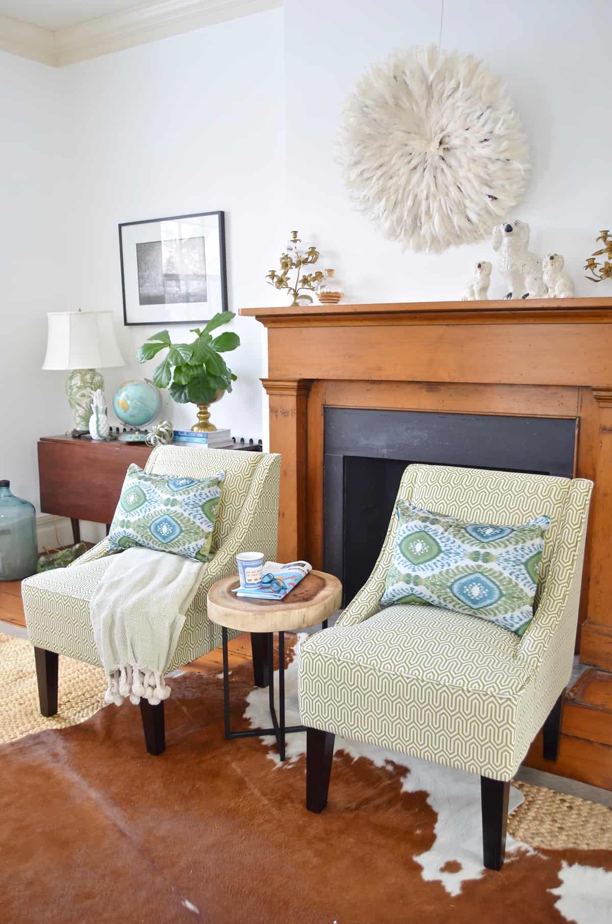 Colorful and bright office decorated with seating area and eclectic accessories.