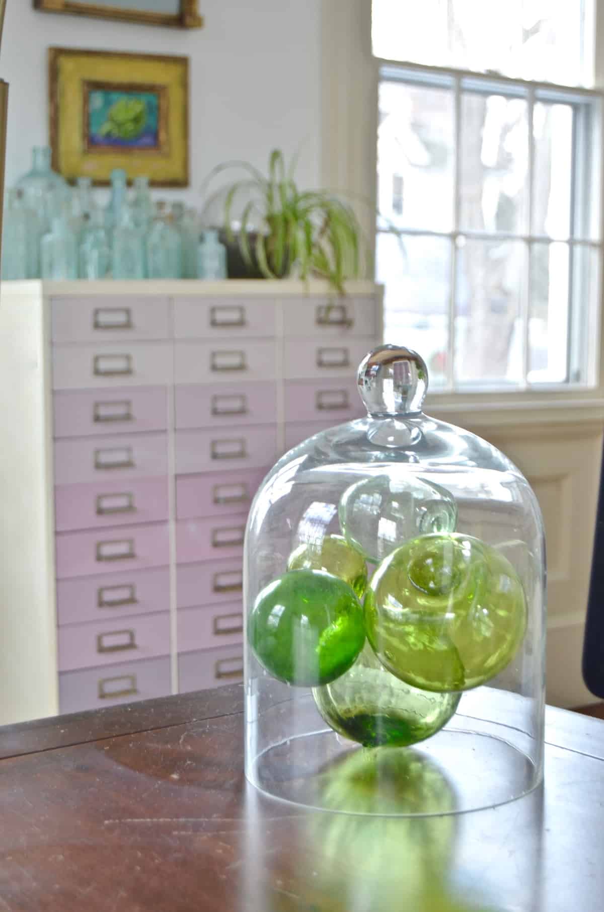 Colorful and bright office decorated with seating area and eclectic accessories.