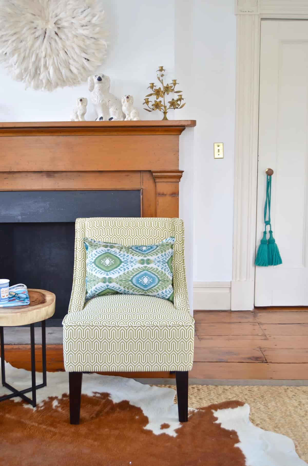 Colorful and bright office decorated with seating area and eclectic accessories.