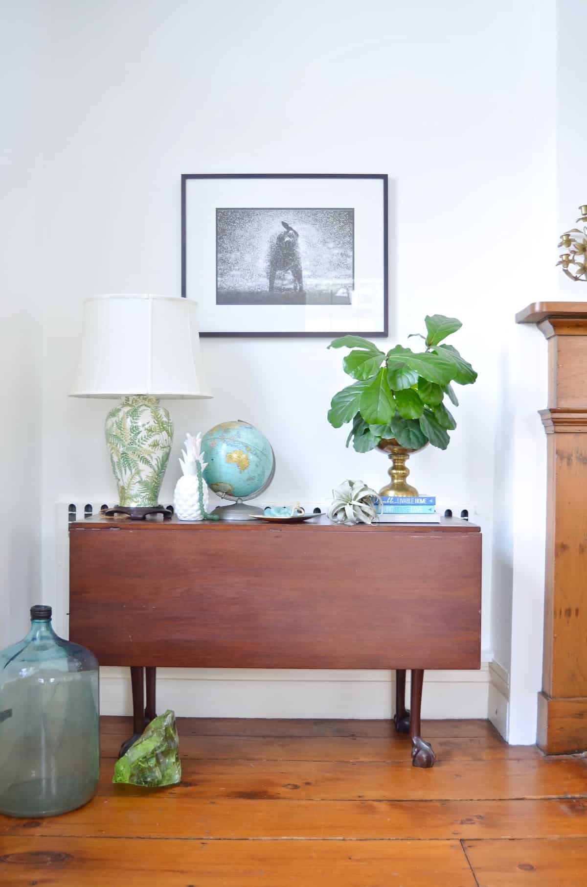 Colorful and bright office decorated with seating area and eclectic accessories.