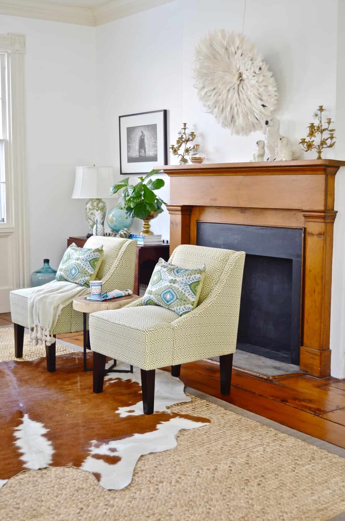 Colorful and bright office decorated with seating area and eclectic accessories.