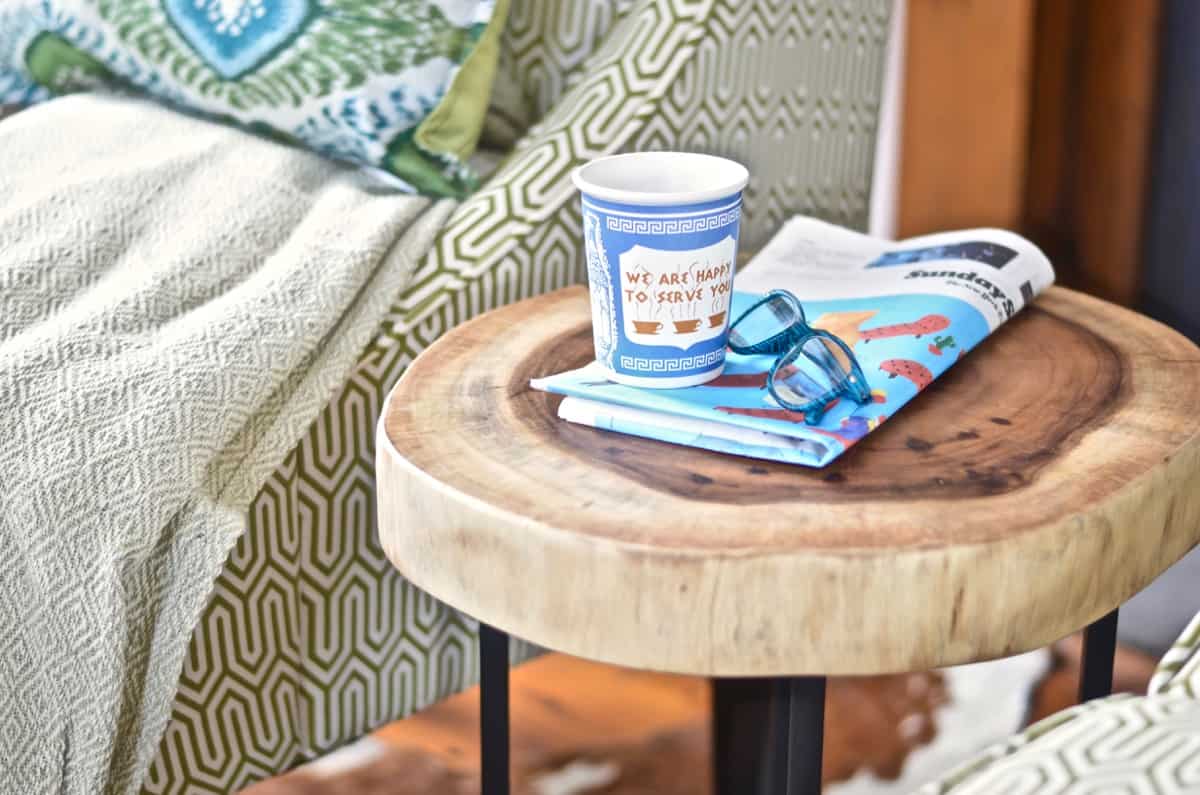 Colorful and bright office decorated with seating area and eclectic accessories.