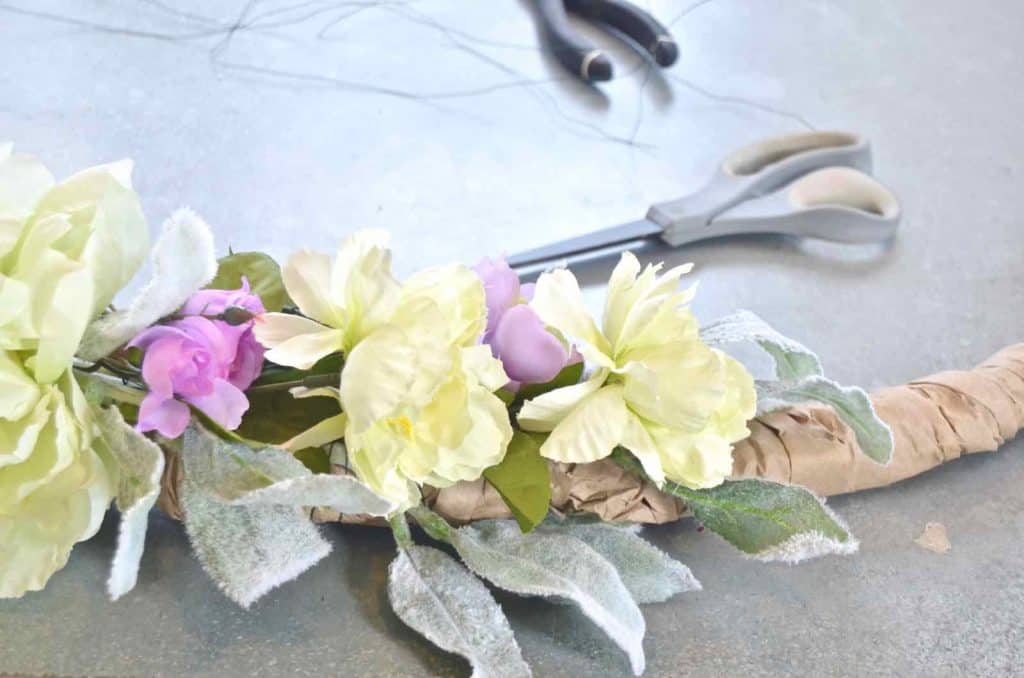 Make a simple, inexpensive spring wreath out of coat hangers!