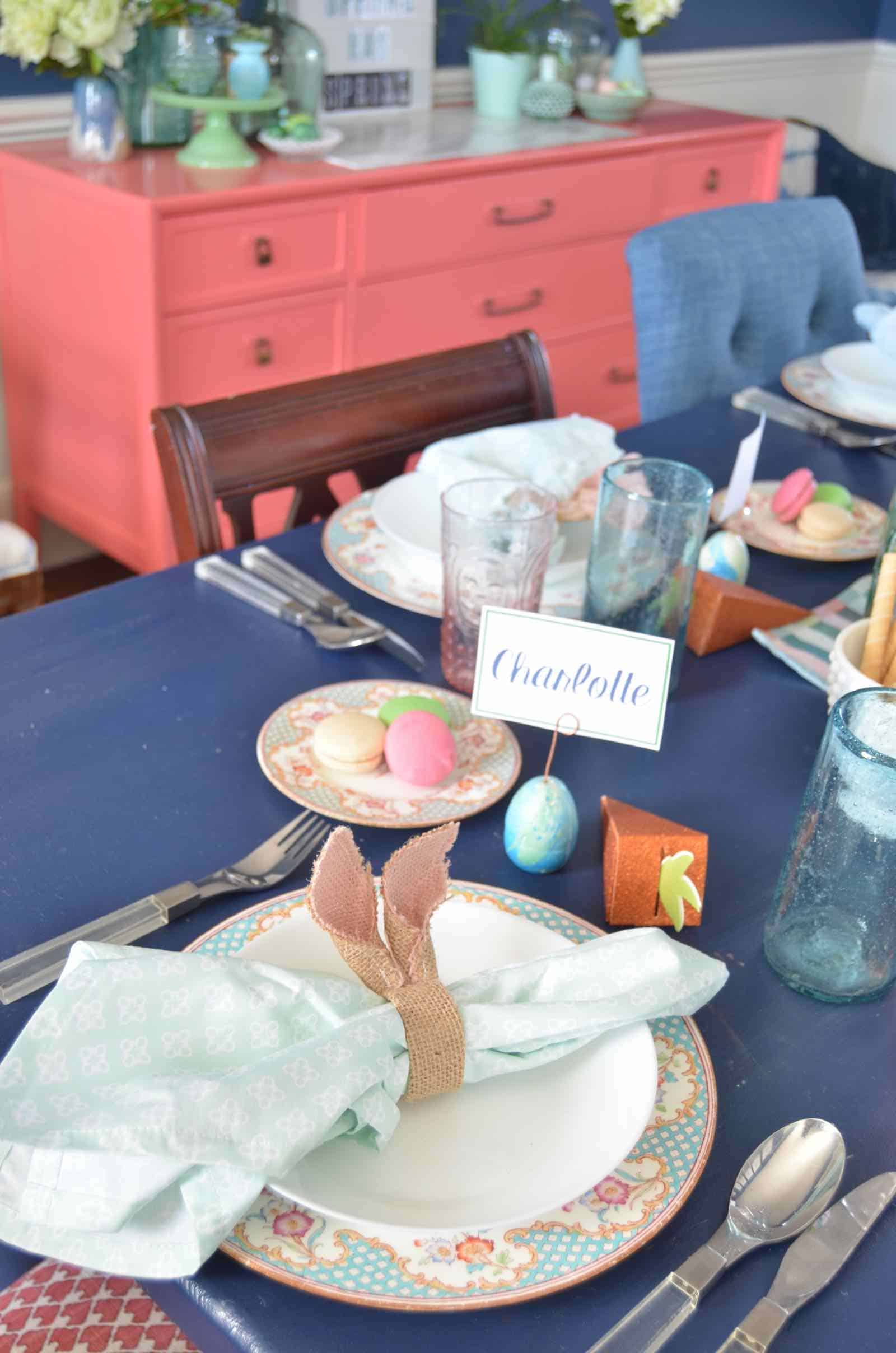 Lush coral and blue eclectic easter tablescape.