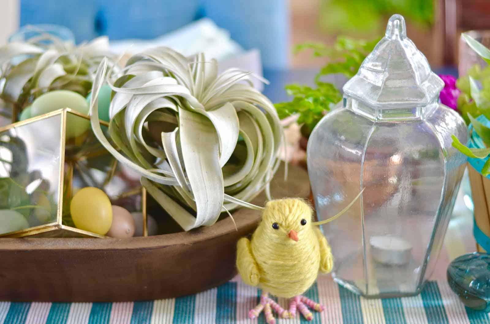 Lush coral and blue eclectic easter tablescape.