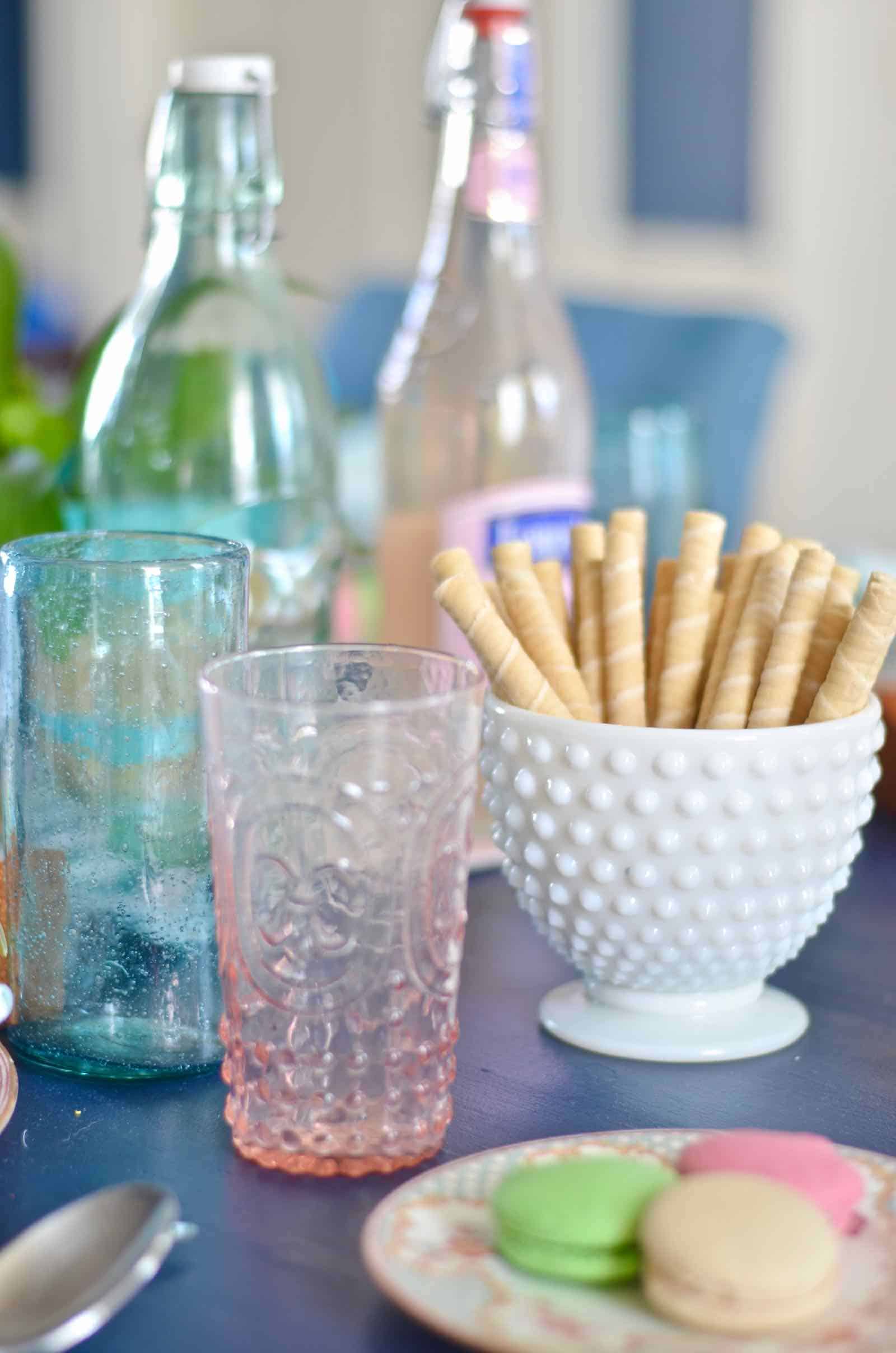 Lush coral and blue eclectic easter tablescape.