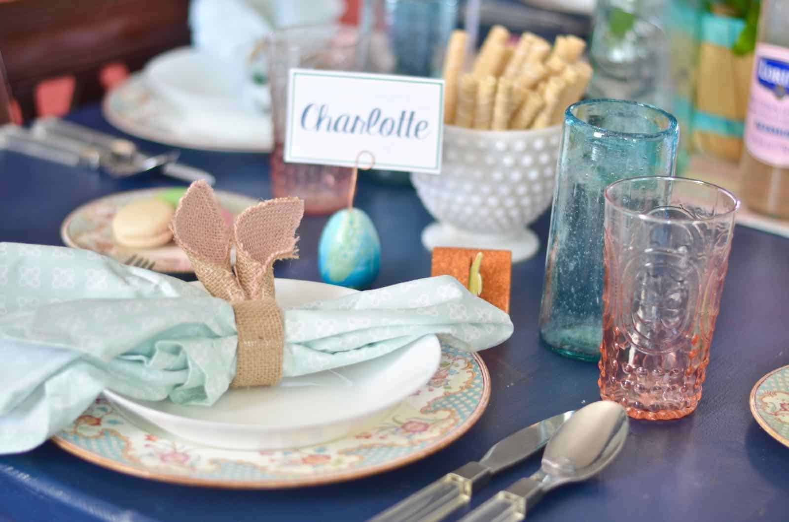 Lush coral and blue eclectic easter tablescape.