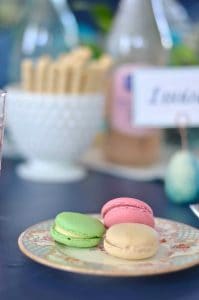 Lush coral and blue eclectic easter tablescape.