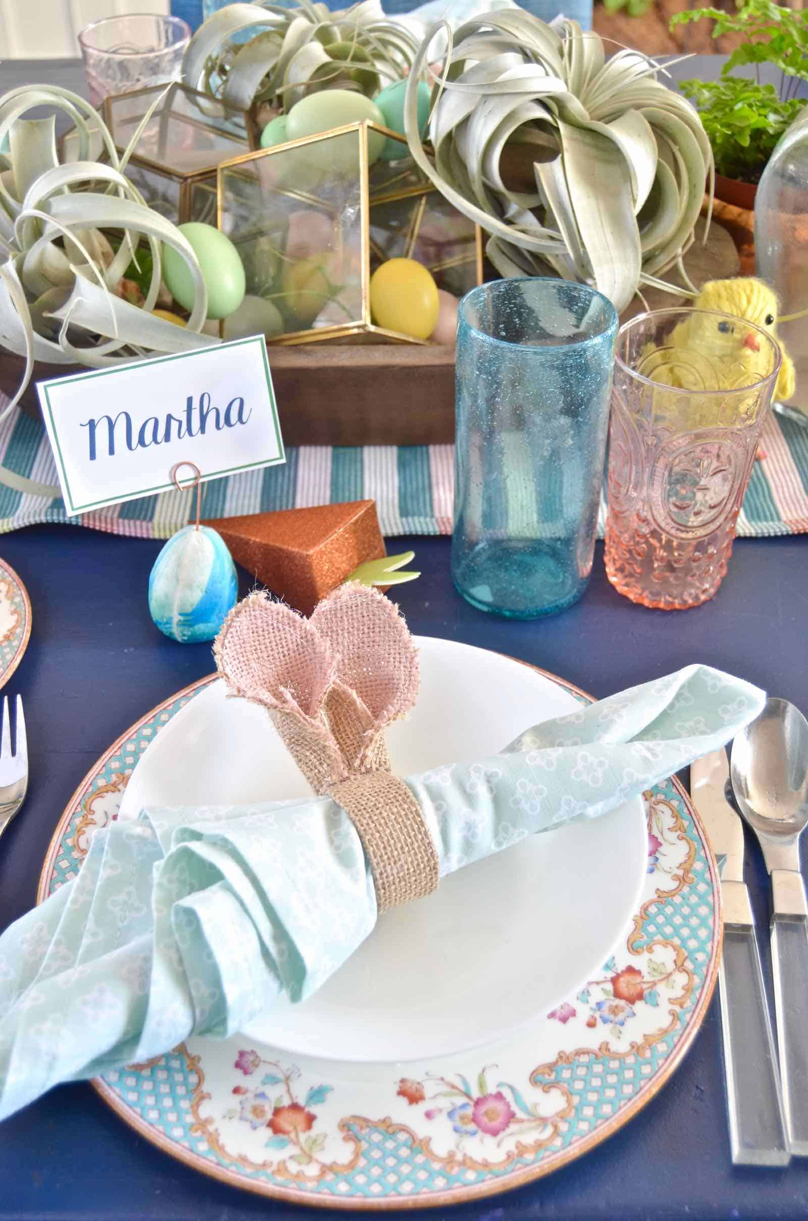 Lush coral and blue eclectic easter tablescape.