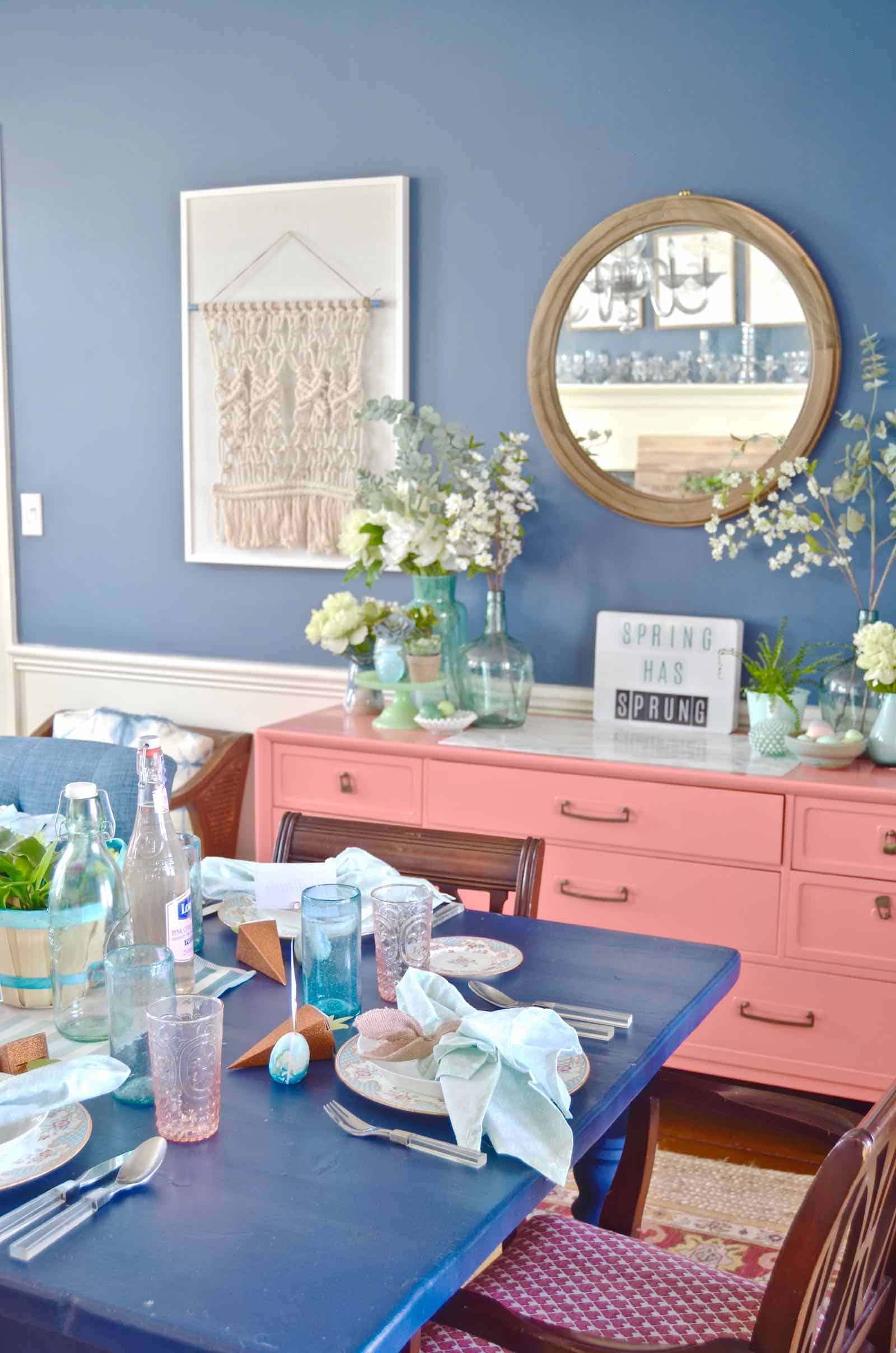 Lush coral and blue eclectic easter tablescape.