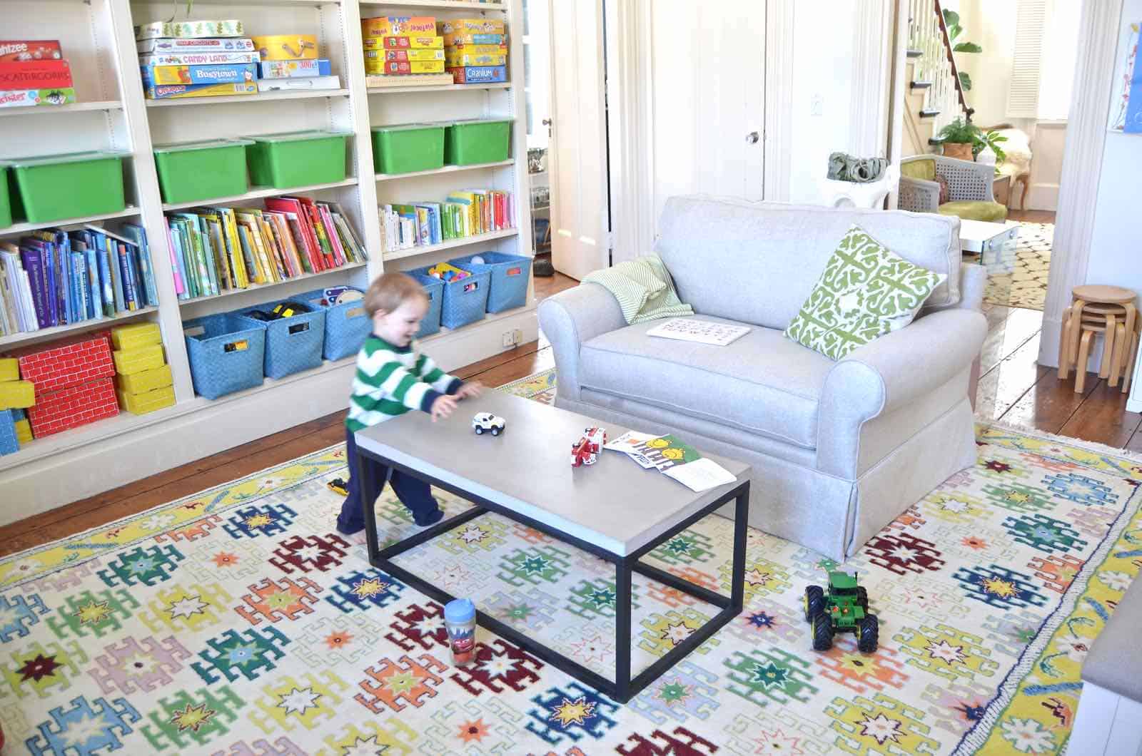 Arthur with trucks in playroom