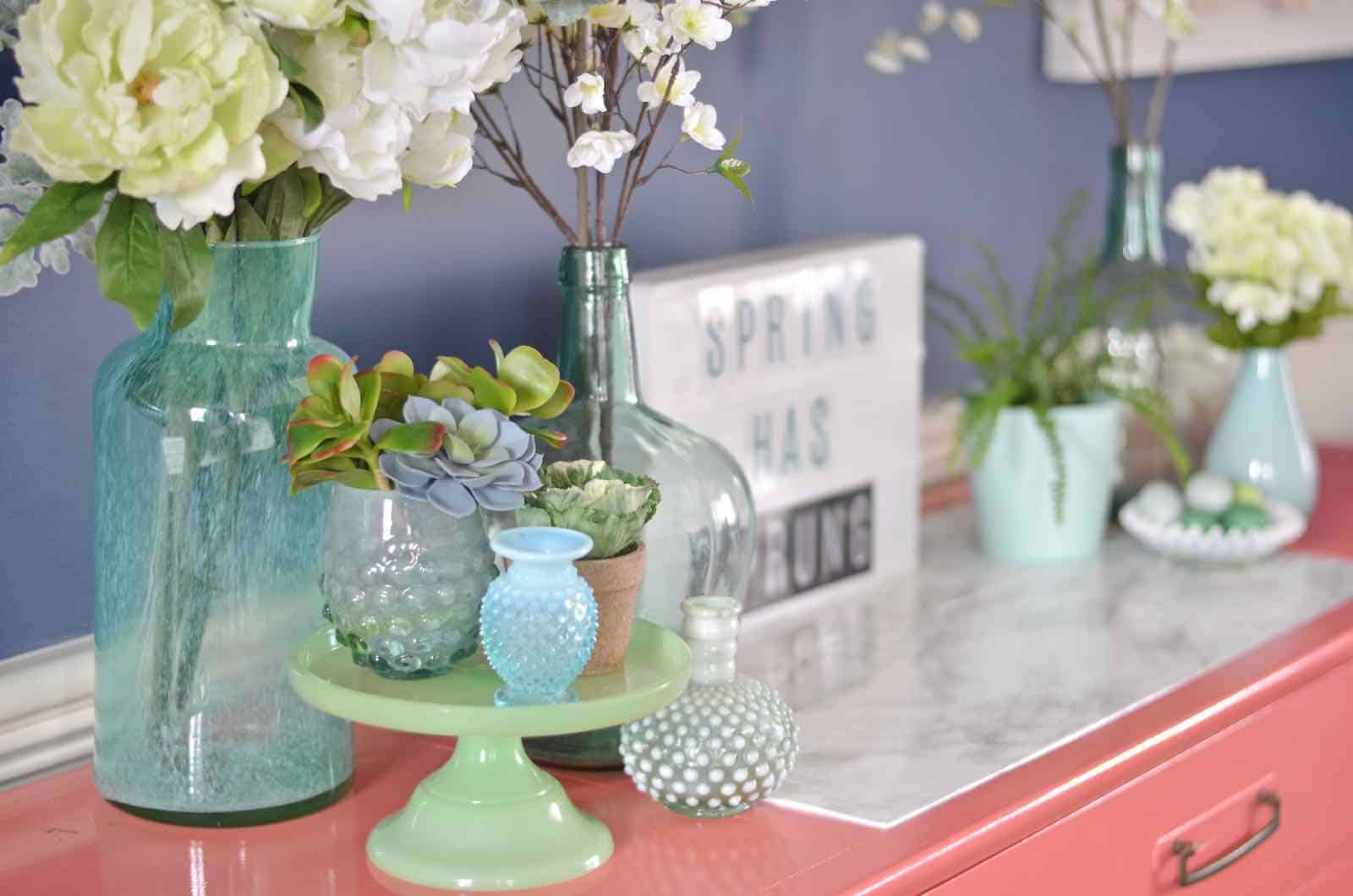 Lush coral and blue eclectic easter tablescape.