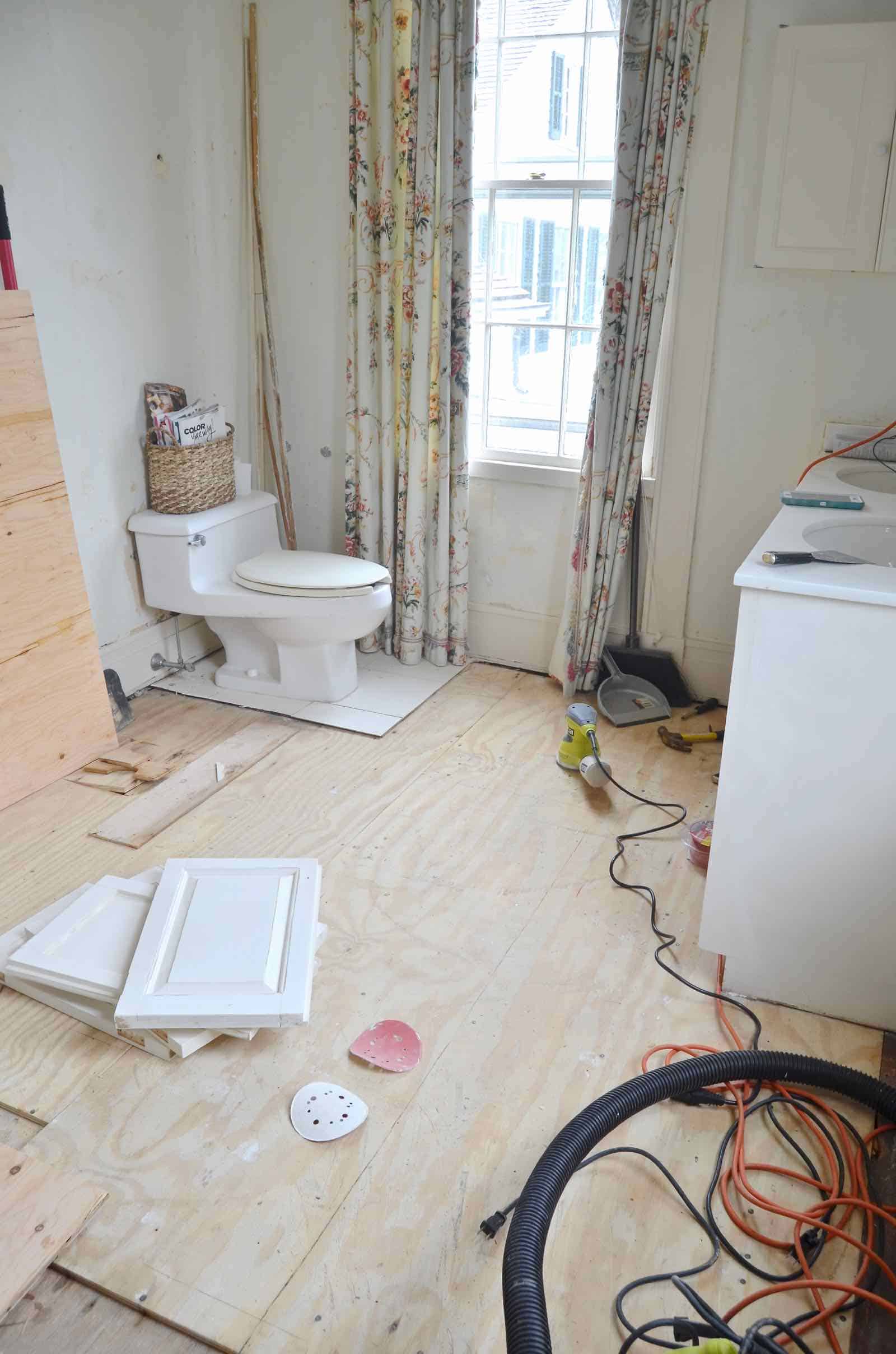 Working on the floor in the master bathroom.