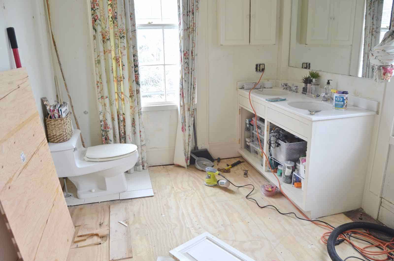 Working on the floor in the master bathroom.